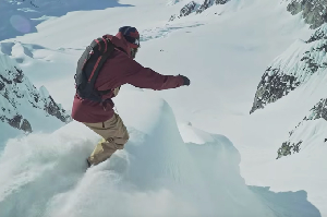 Watch Travis Rice and Eric Jackson Drop Into a Huge Spine in Alaska - Video