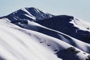 The day after the storm clears, the terrain re-shaped by the wind and snow light, dry and untouched. Seriously, you can almost hear the hoots from Buff Farnell and Drew Jolowicz as they drop into a backcountry line. Photo: Dylan Robinson