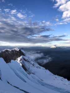 View from the summit of Anitsana. Cotopaxi in the background is active, you can tell by the plume emanating from the summit. Photo: Lucas