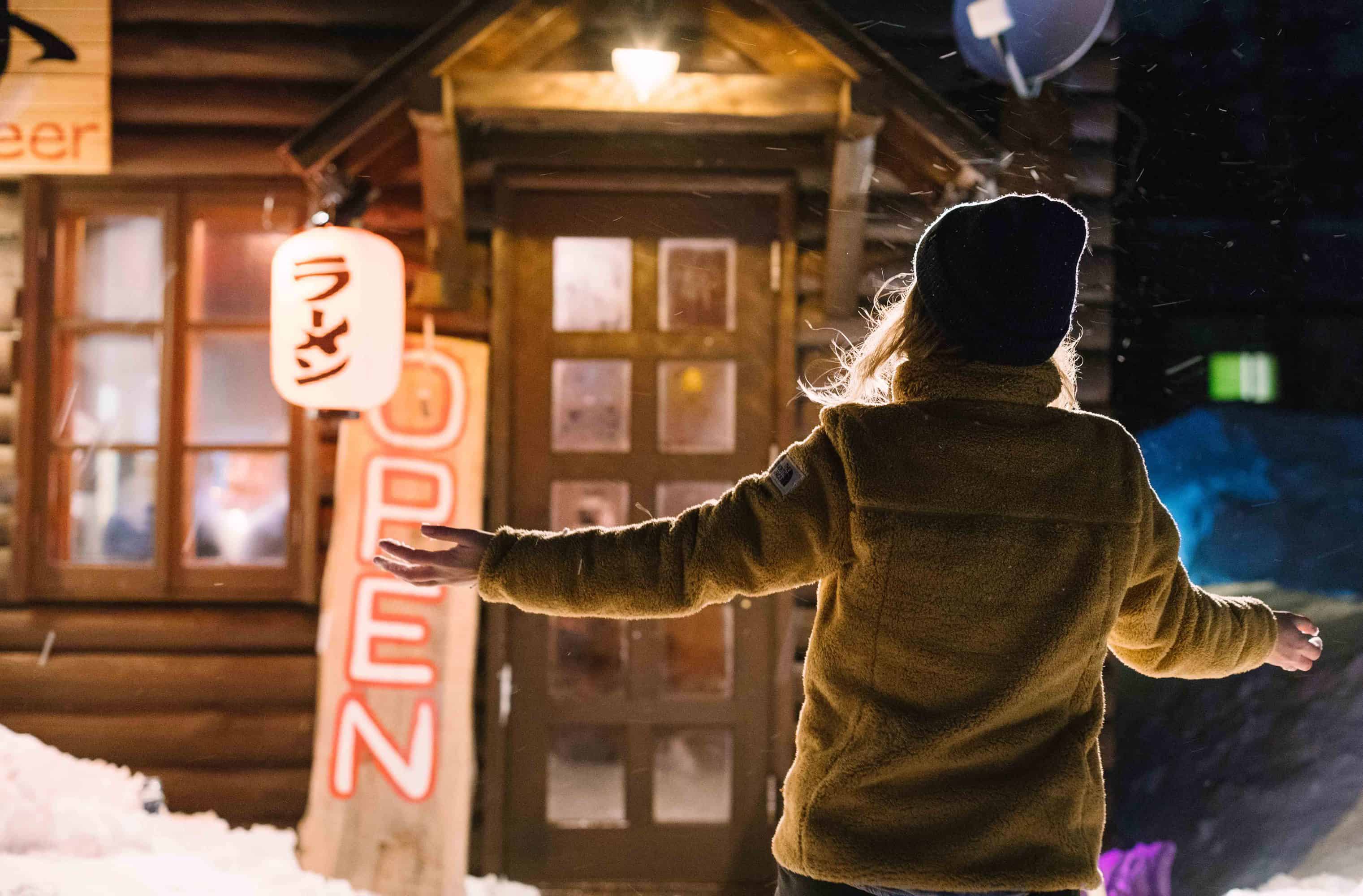 Woman outside a small Japanese restaurant in Hakuba. 