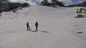 A couple of keen skiers hiking up after a coupe flaps on Towers in Falls Cree