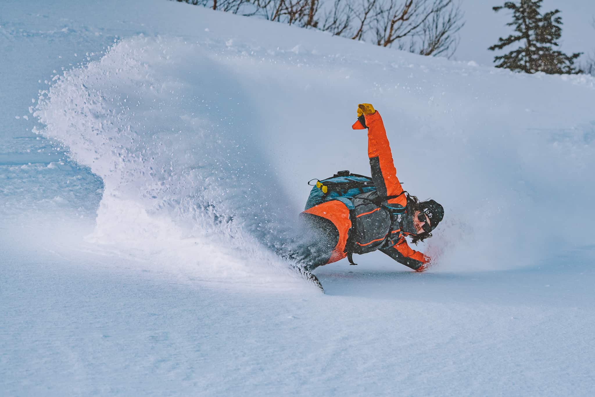 Snowboarder on an open Hakuba powder bowl with plenty of room to move.