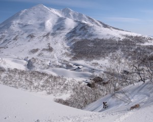 Justin “Grover” Graves followed by his loyal dog, Mr. Winston. This area of the Niseko backcountry is just a short drive from the resort and offers views of the backside of Mt. Niseko-Annupuri and a plethora of peaks to hike and ride.
