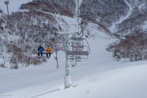 A slow start to the season means downloading at Hirafu, Niseko. That shook change soon with a good storm n the way. Photo: Sea and Summit Media