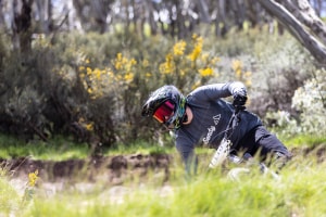 A competitor hooking into the tight berms in the open mens. Photo: Thredbo