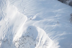 Saki Hayashi heading into  a serious line in the Hokkaido backcountry earlier this week. The epic conditions are set to continue. Photo: Sea and Summit Media