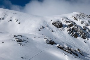 Hiking for freshies in The Remakables on the weekend. Fresh snow will be fallign to much lower elevations this week as cold SWwirflowe takes hold. Photo: The Remarkables