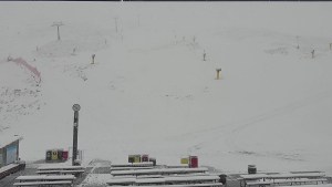 Snow falling in Coronet Peak this morning, but it is case of too little, too late, the resort announcing it is now closed for the season after yesterday's heavy rain washed out the base.