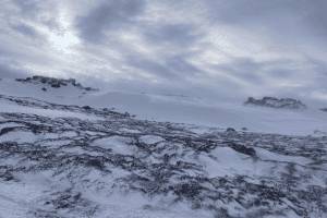 The small amount of snow that fell in the alpine on Thursday night has been wind loaded onto easterly slopes with extensive areas of ice crust and exposed vegetation remaining elsewhere. Pic: Taylor Rogers