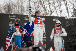Laura Peel celebrates her win wiht silver medalist Karenna Elliott (US) on the left and fellow Australian Airleigh Frigo who took bronze. Photo: FIS Freestyle