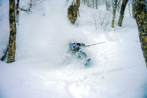 Mnalou Peterson, loving life on a deep Hakuba powder day during a visit in February. Photo: Henry Brant